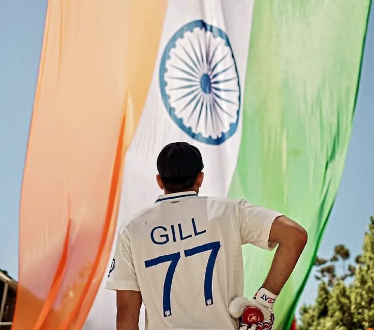 shubman gill posing with indian flag